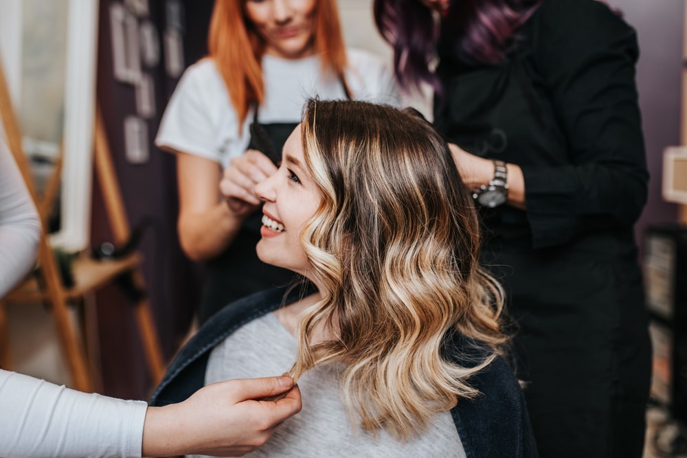 woman smiling in the salon chair