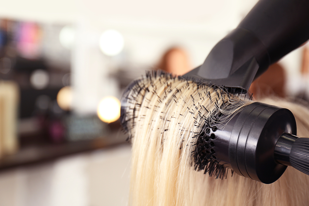 Blond hair being hair dried