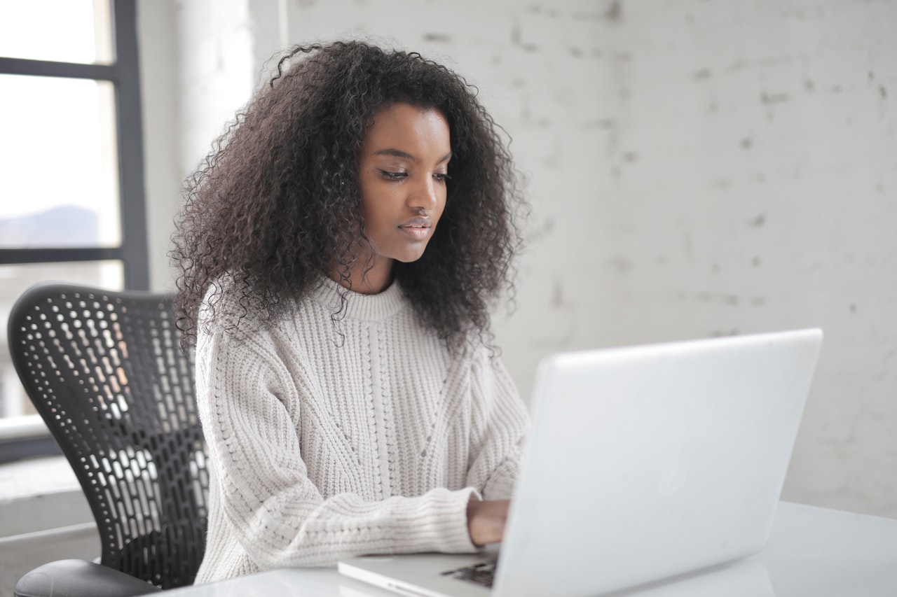 Woman using a laptop.