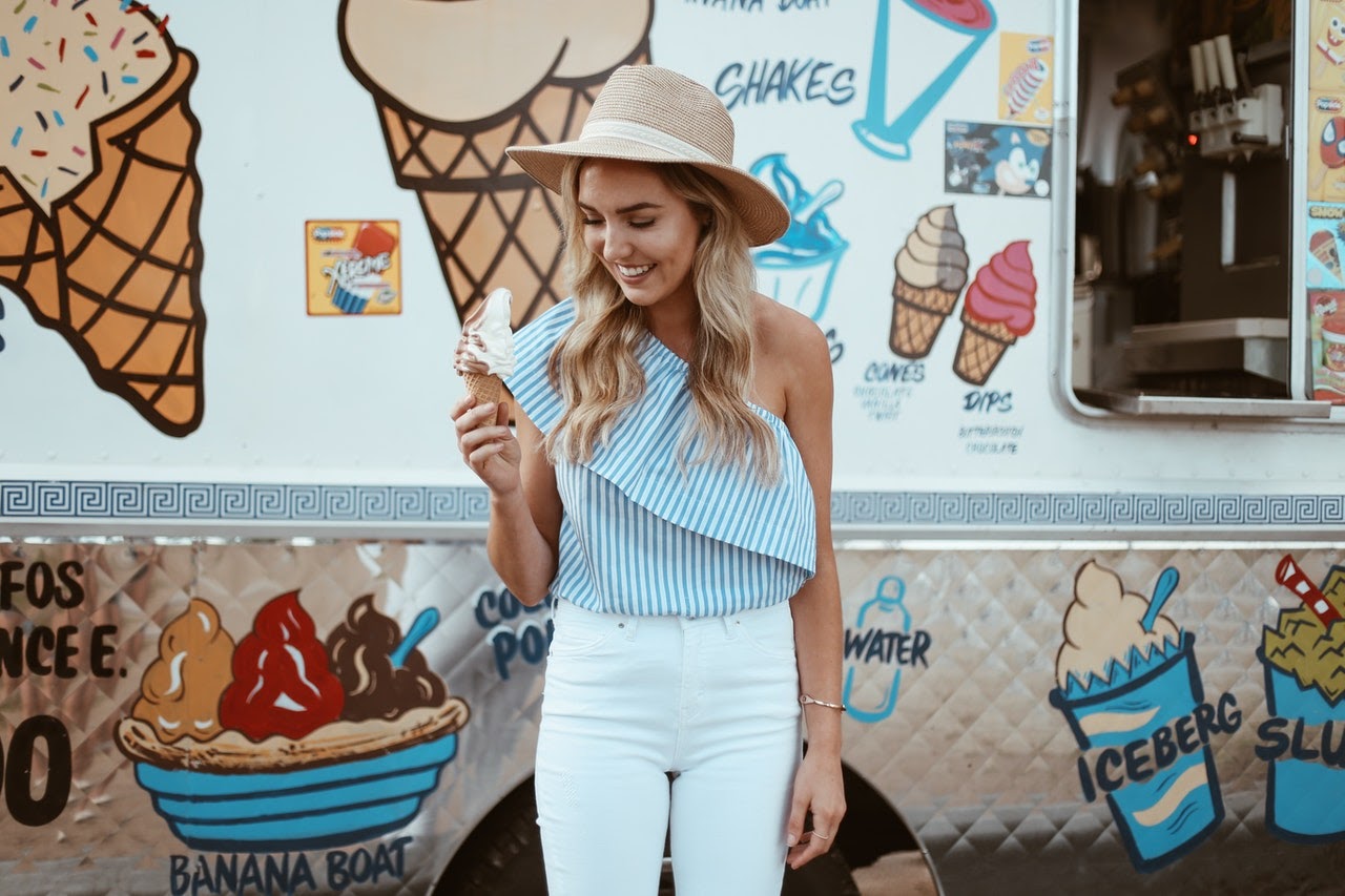 woman smiling and eating icecream